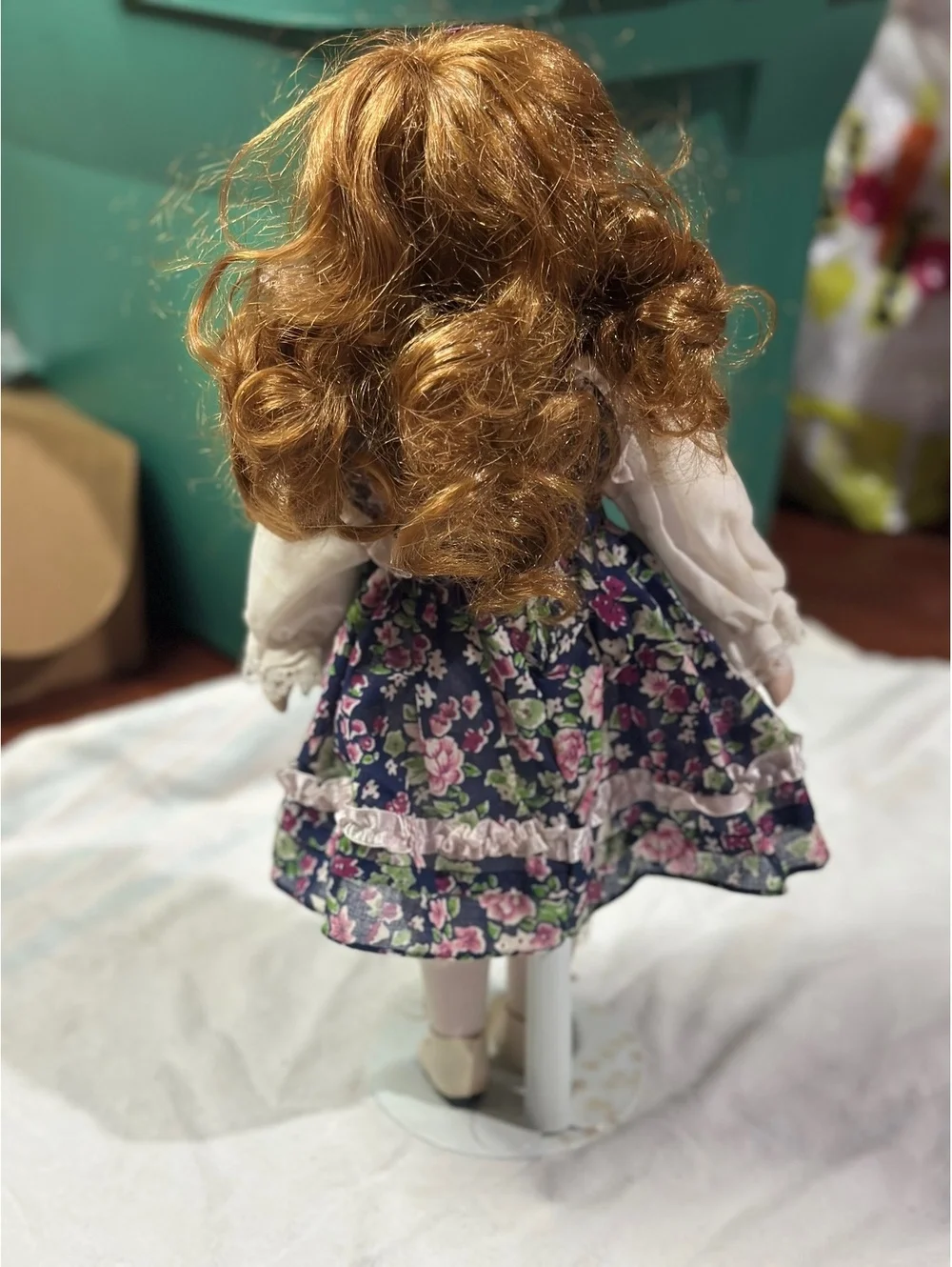 Vintage Porcelain Doll with Floral Dress and Curly Red Hair